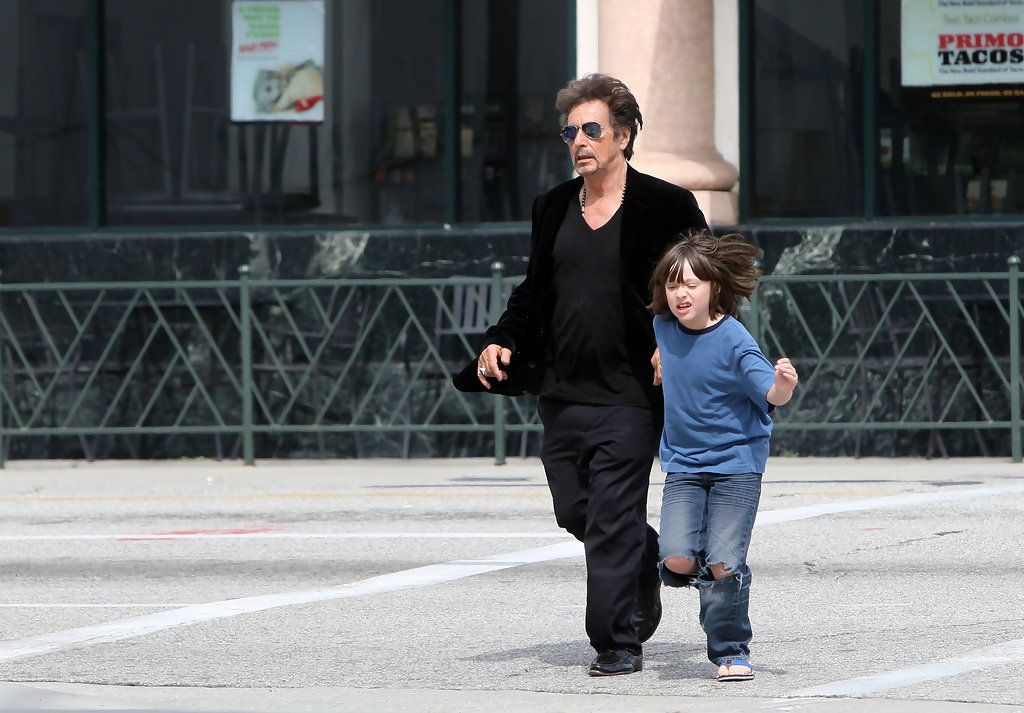 Anton James Pacino wearing blue shirt with his father, Al Pacino wearing black outfit