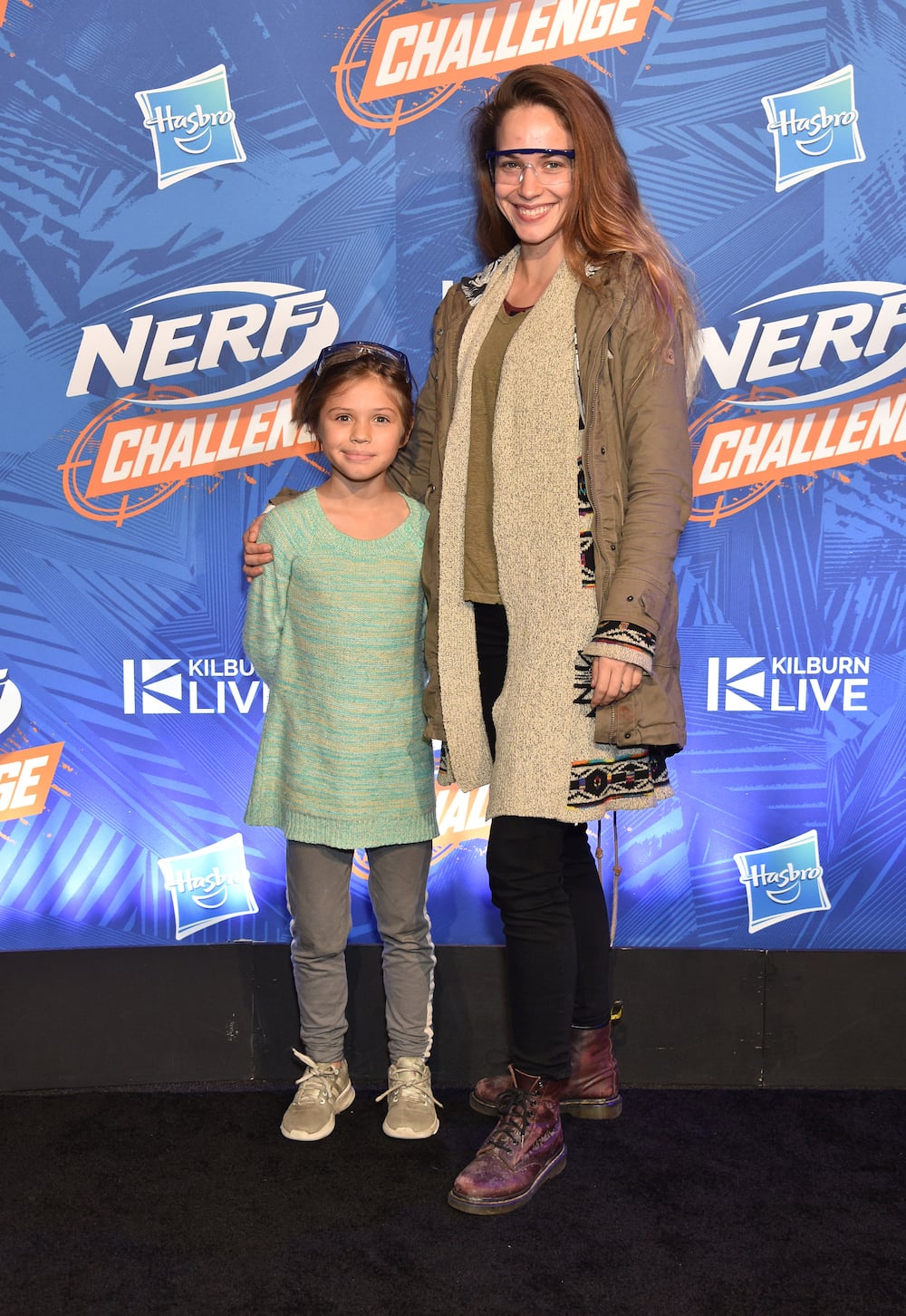 Alexis Knapp wearing a brown jacket with her daughter, Kai Knapp