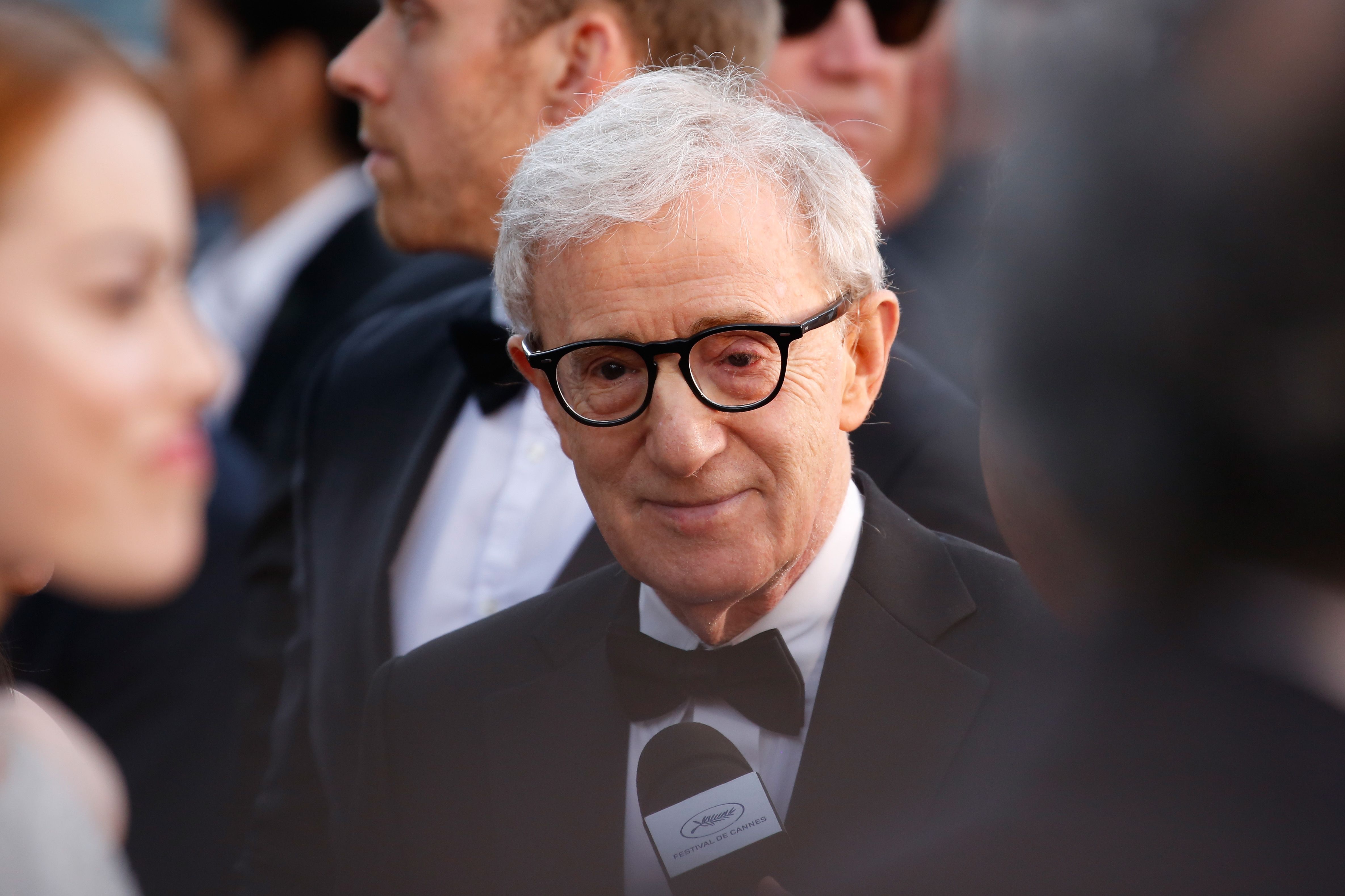 Woody Allen wearing a black suit