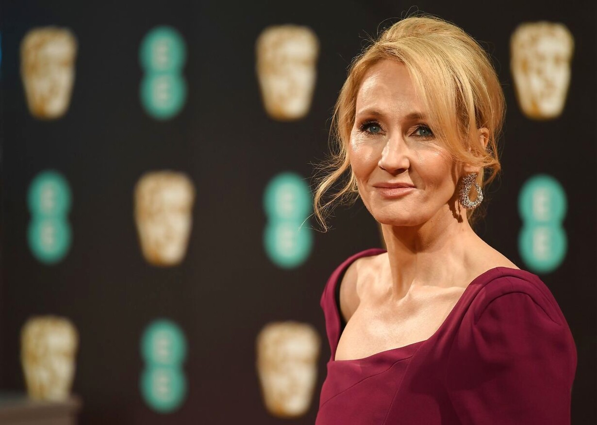J.K. Rowling wearing a magenta outfit