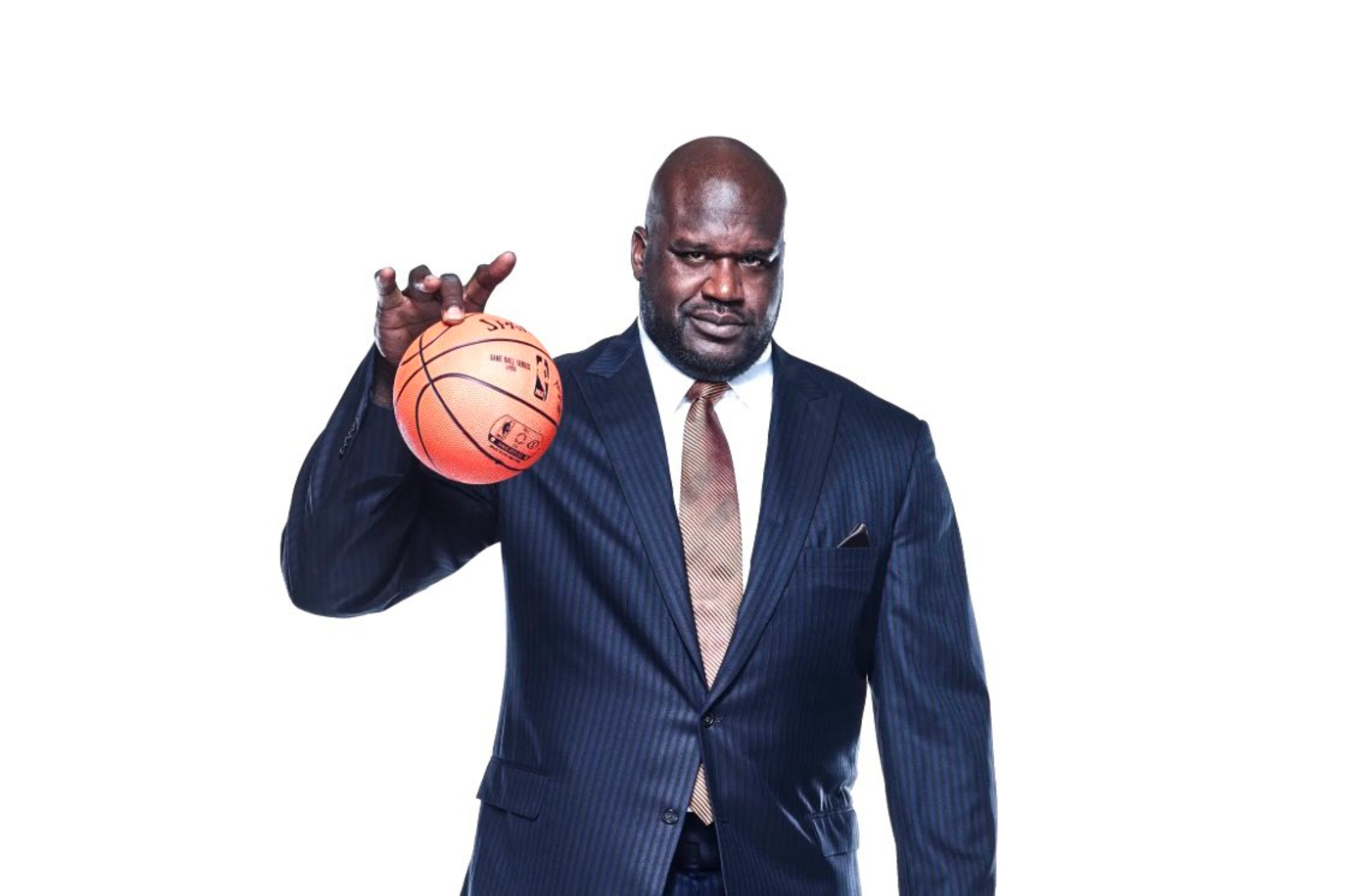 Shaquille O'Neal wearing a stripes blue suit white holding a basketball