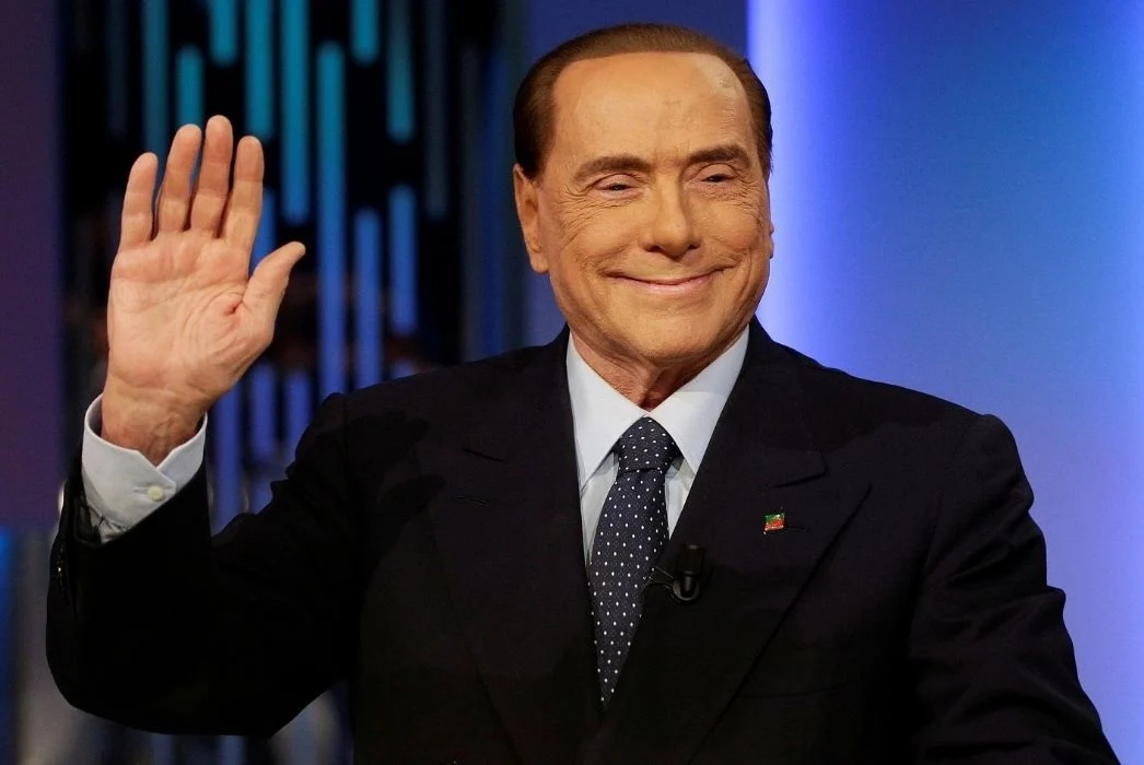 Silvio Berlusconi waving
