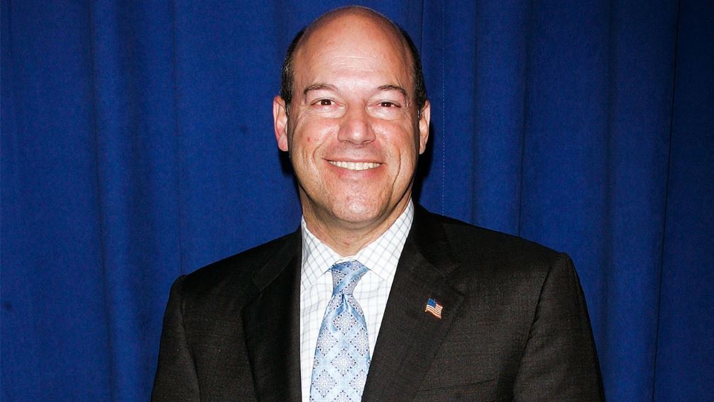 Ari Fleischer wearing a suit with a smile on his face