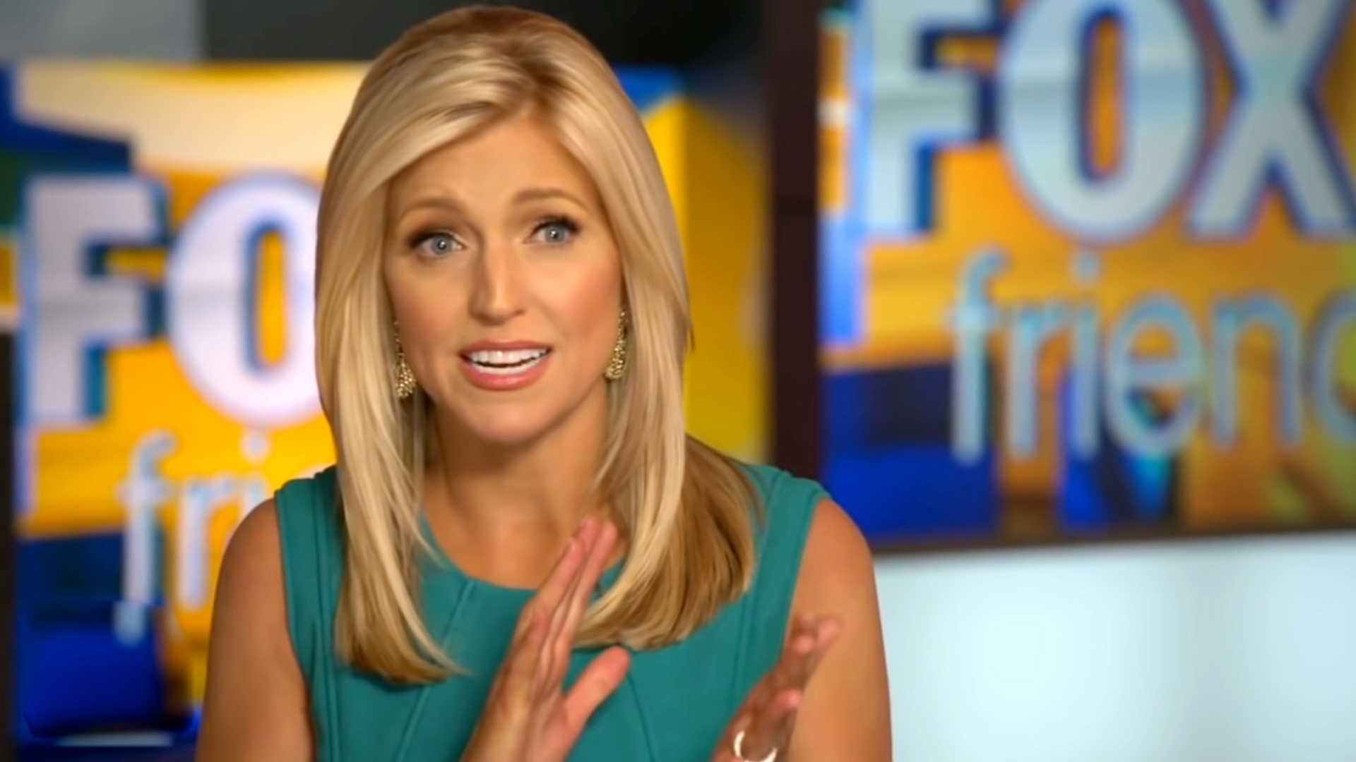 Ainsley Earhardt wearin a green grown during a presentation on Fox News Channel