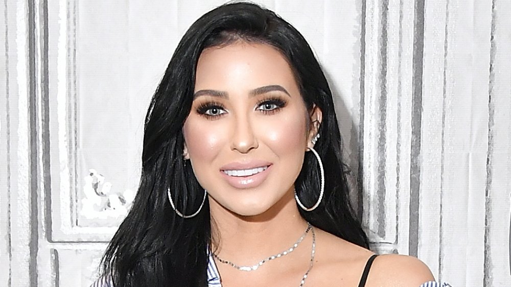 A headshot of Jaclyn Hill with a smile on her face