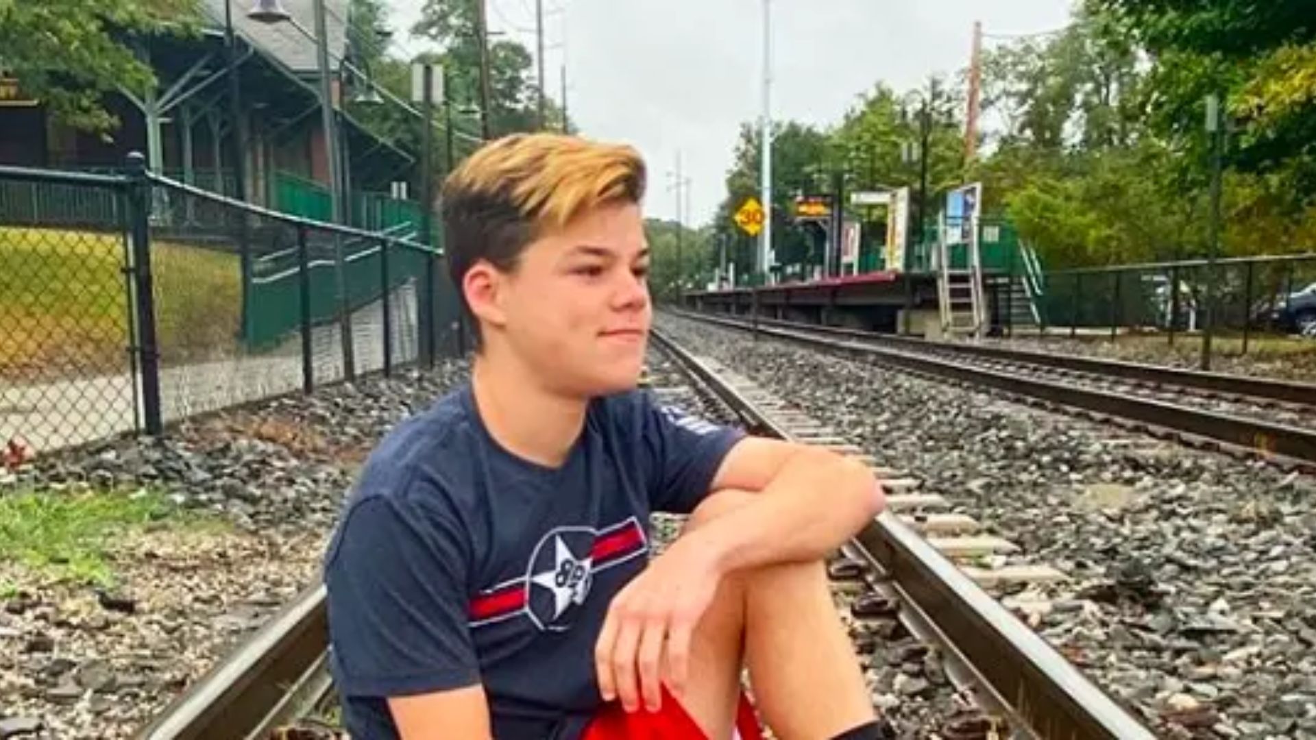 Jack Doherty Sitting On Railway Track