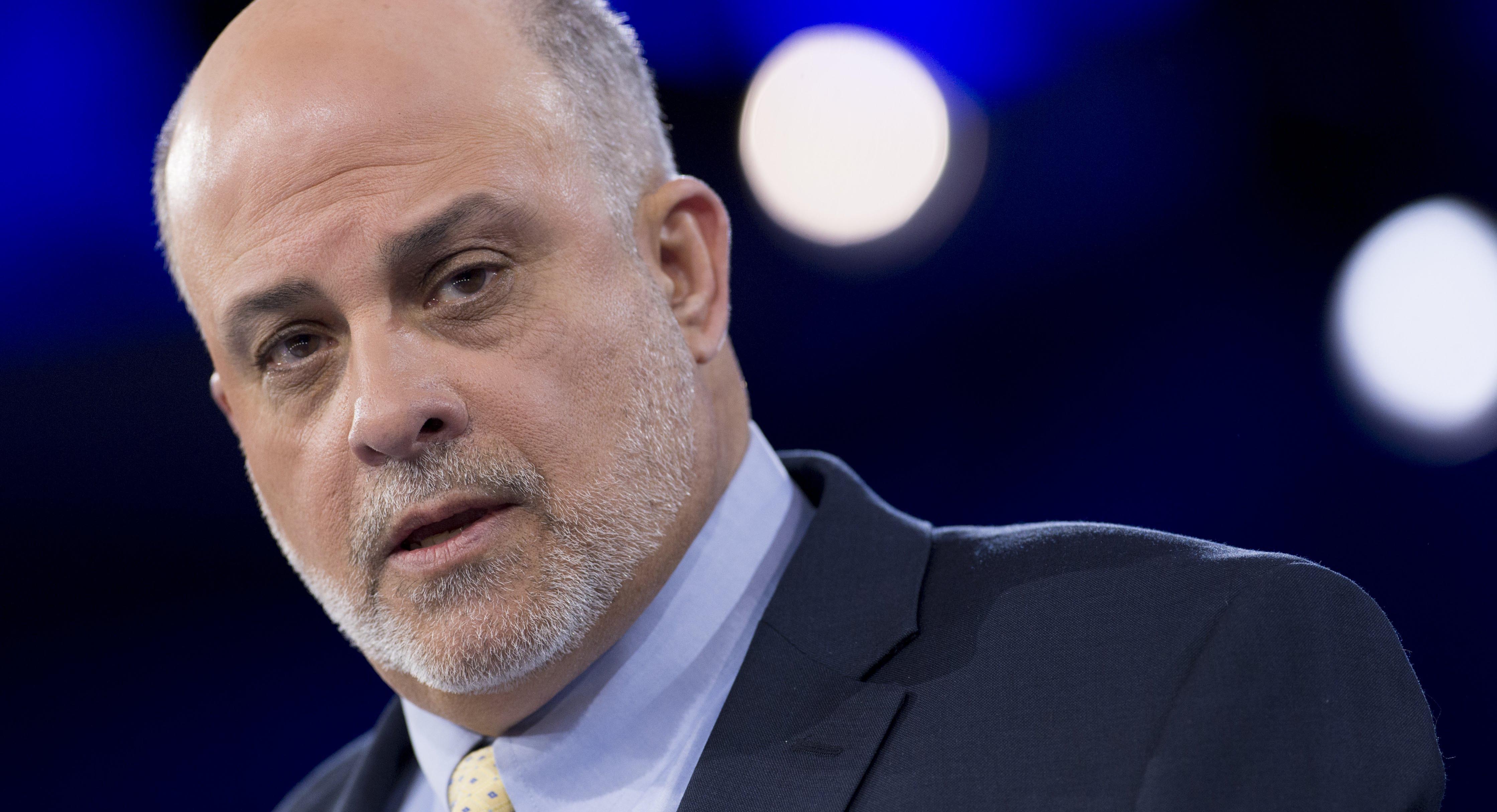 Mark Levin wearing a suit on a shirt and tie