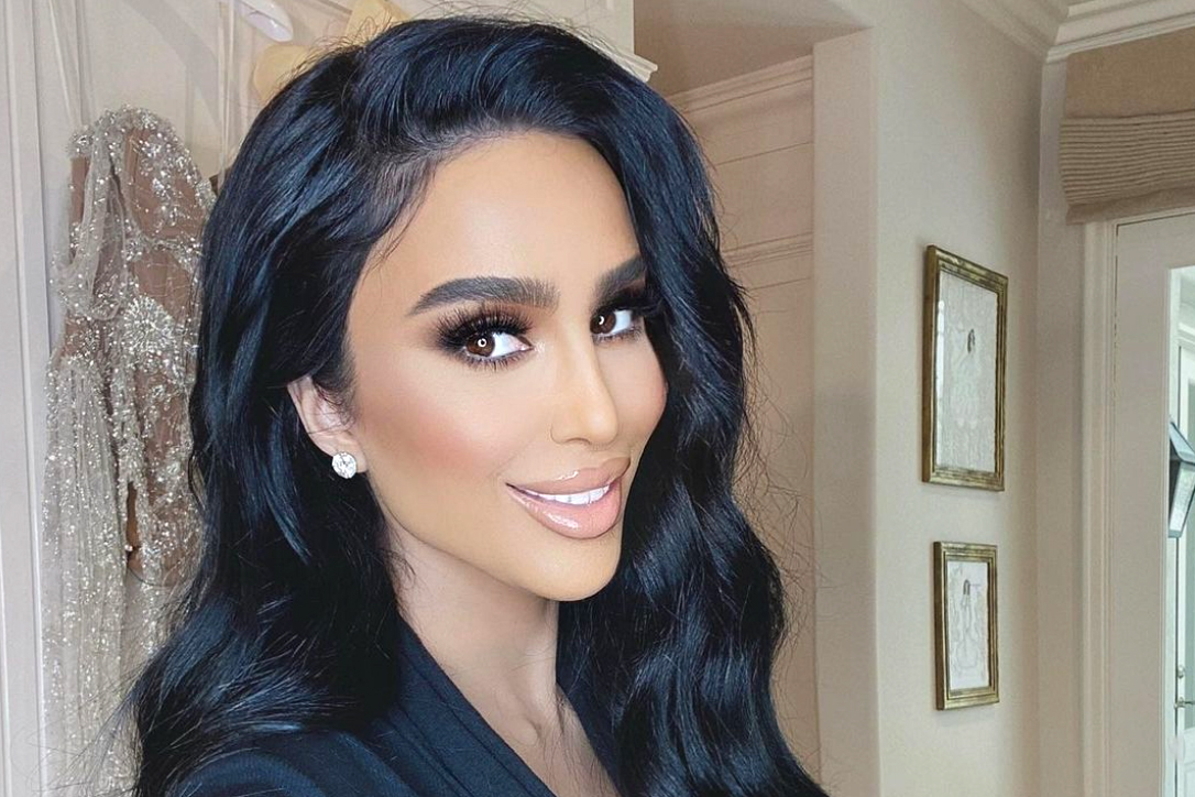Lilly Ghalichi wearing a black clothe with a smile on her face