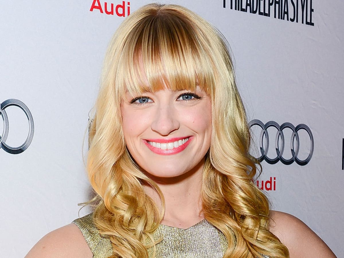 Beth Behrs with a big smile on her face at an event