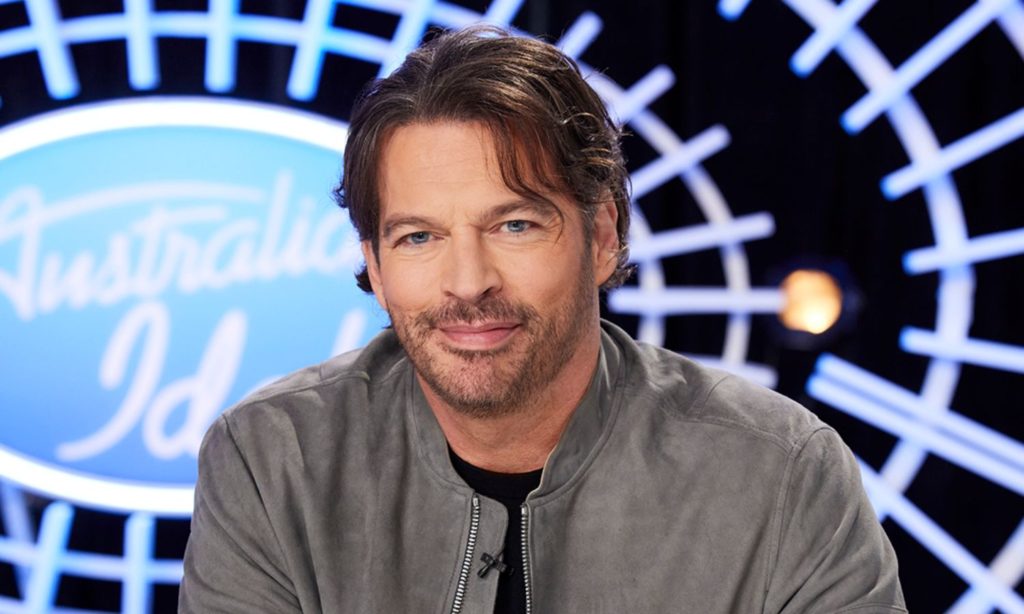 Harry Connick Jr. wearing a gray jacket and black shirt