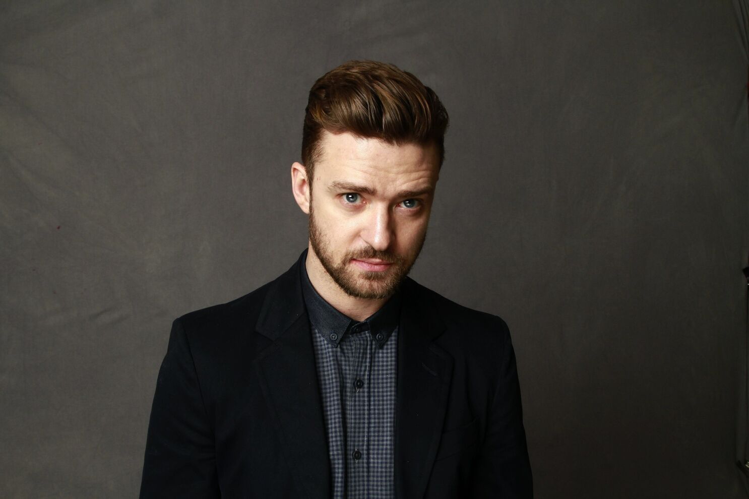 Justin Timberlake wearing a black coat