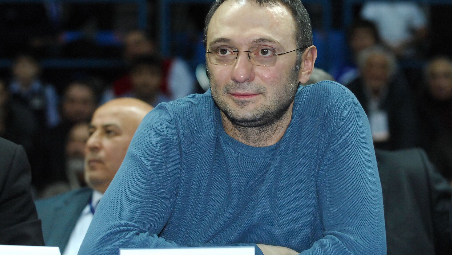 Suleiman Kerimov wearing a blue sweater