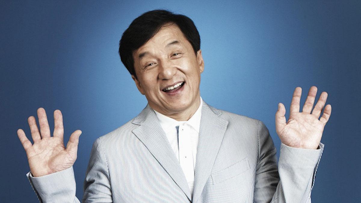 Jackie Chan wearing a gray suit