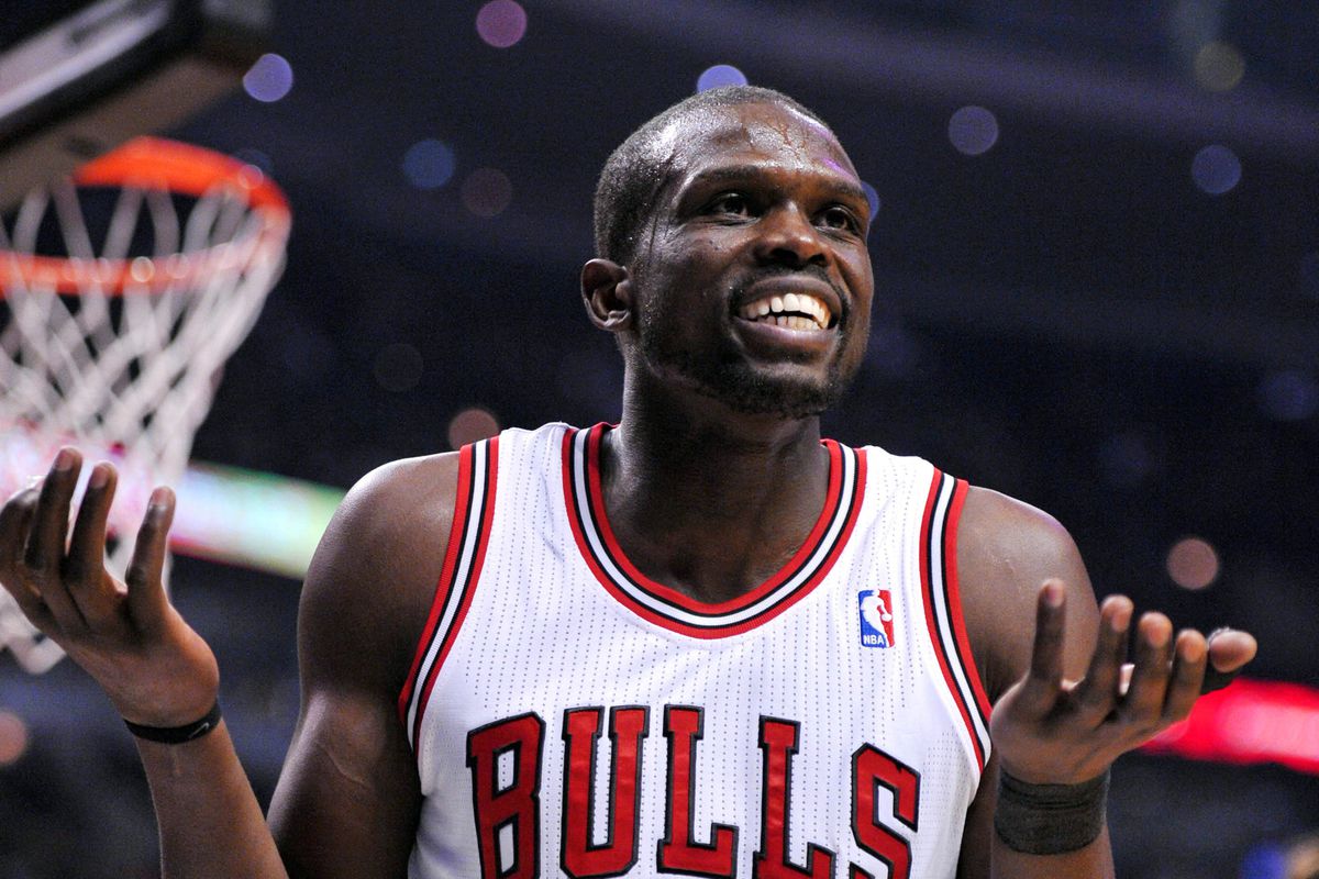 Luol Deng weaaring a white Chicago Bulls basketball jersey