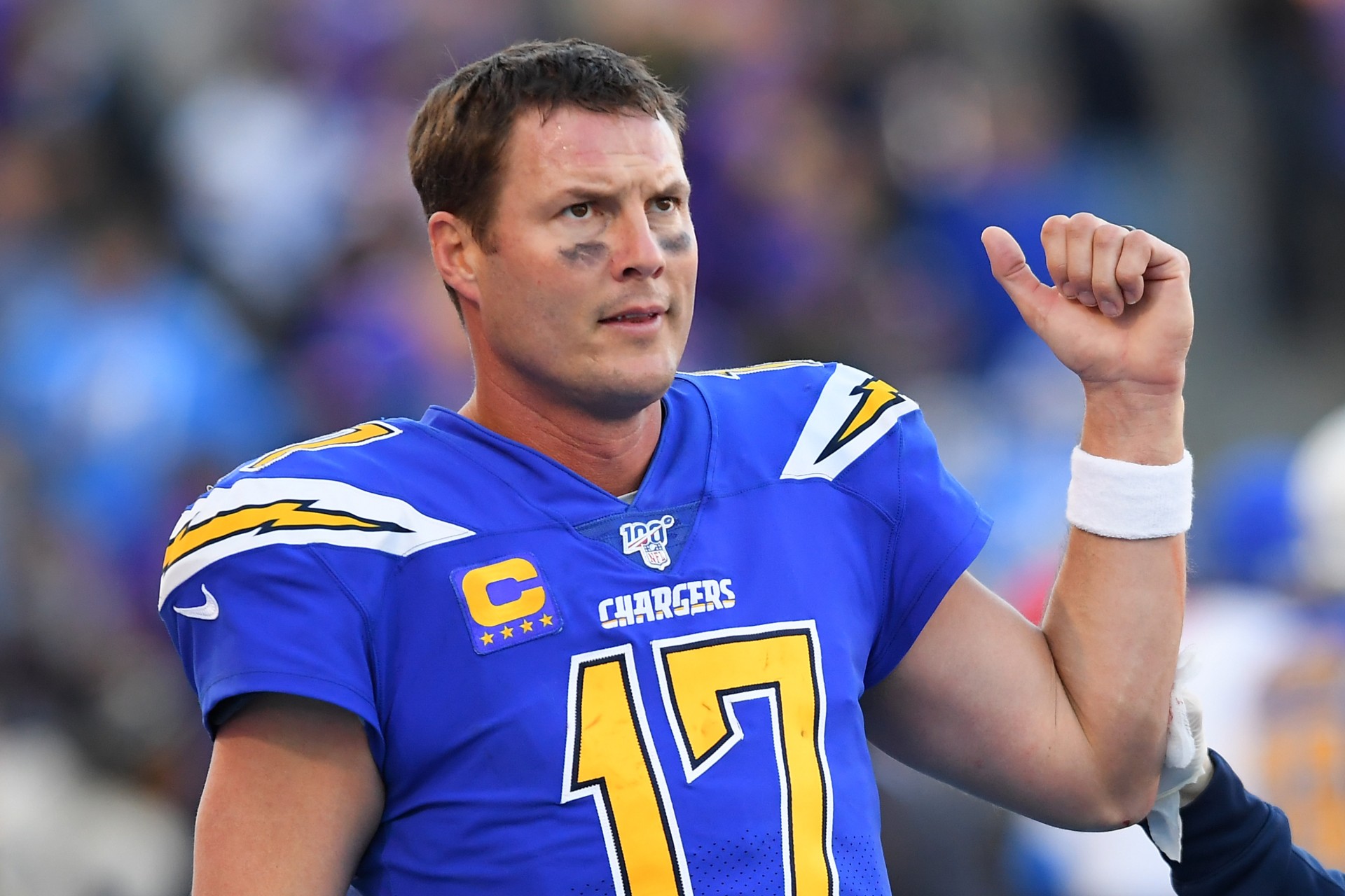 Philip Rivers wearing a blueee football uniforrm and a white wristband