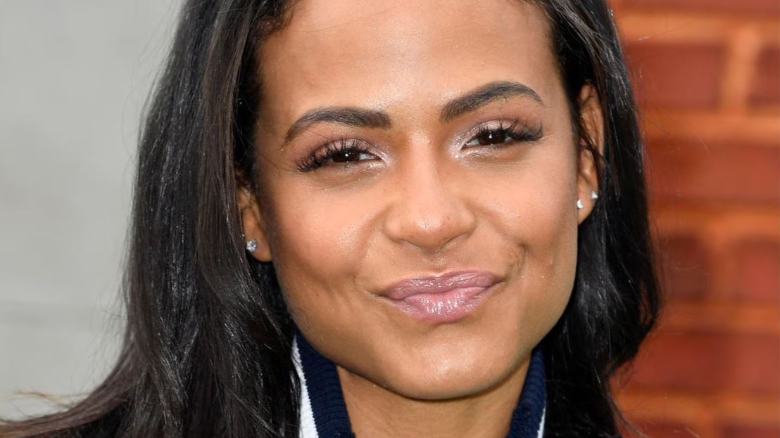 A headshot of Christina Milian with a smile on her face