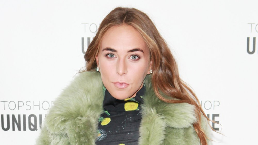 Chloe Green wearing a green fur coat