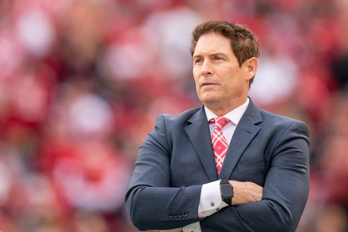 Steve Young wearing a black suit