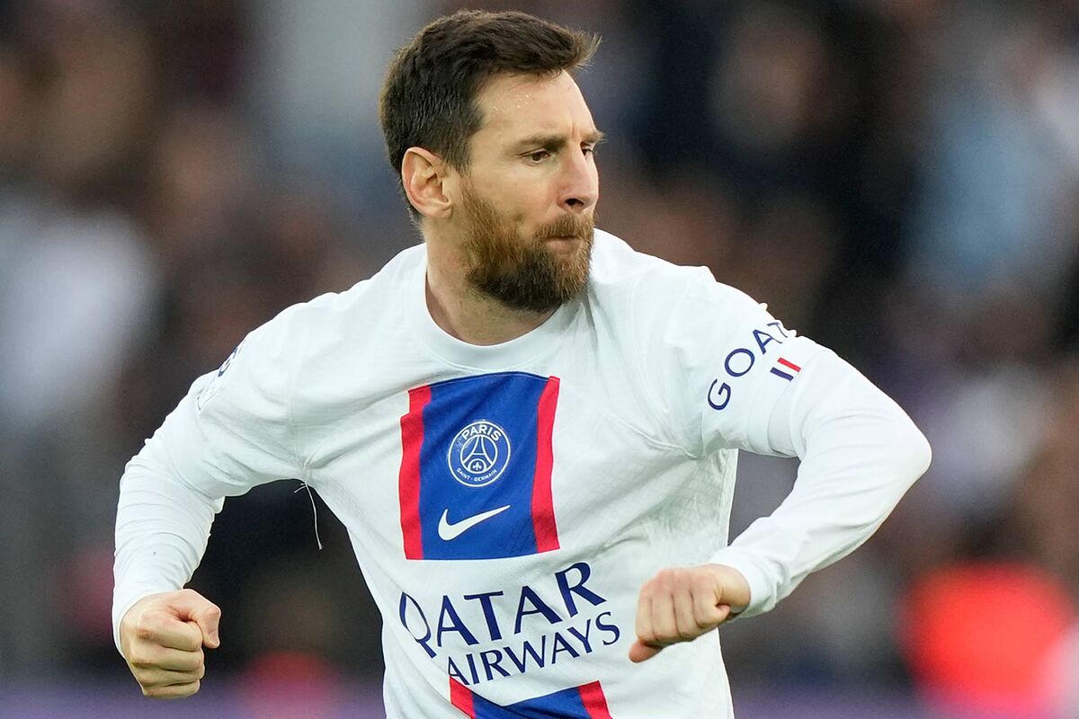 Lionel Messi wearing white Qatar football uniform