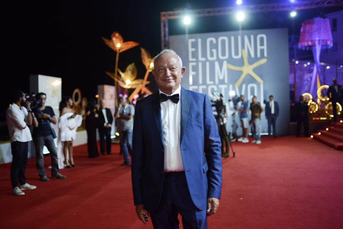 Naguib Sawiris wearing a blue suit and black bow tie at the Elgouna Film Festival