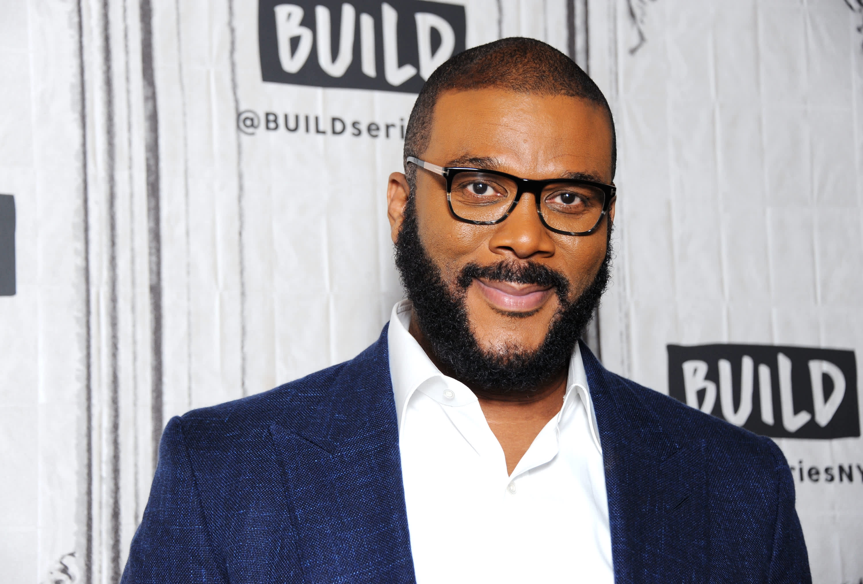 Tyler Perry wearing a blue suit