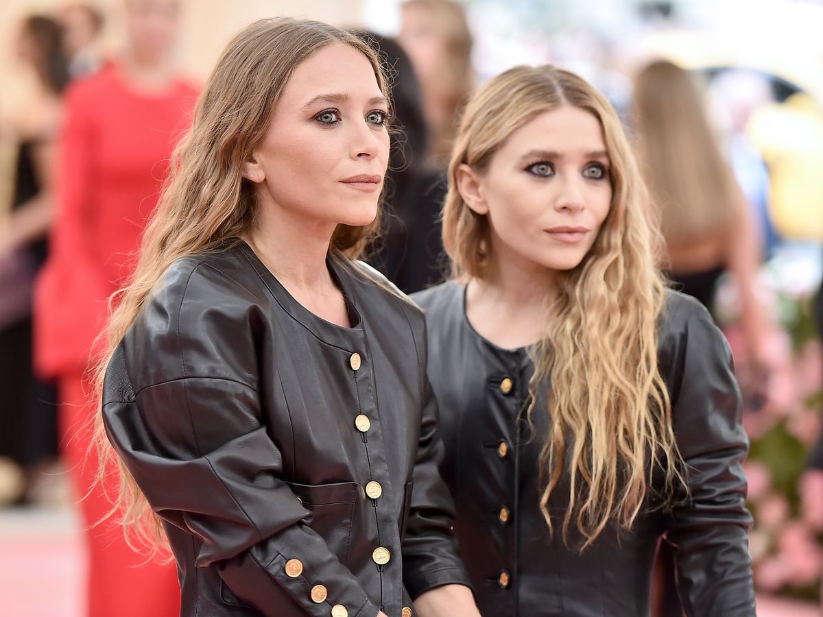 Mary-Kate And Ashley Olsen wearing a black matchy outfit