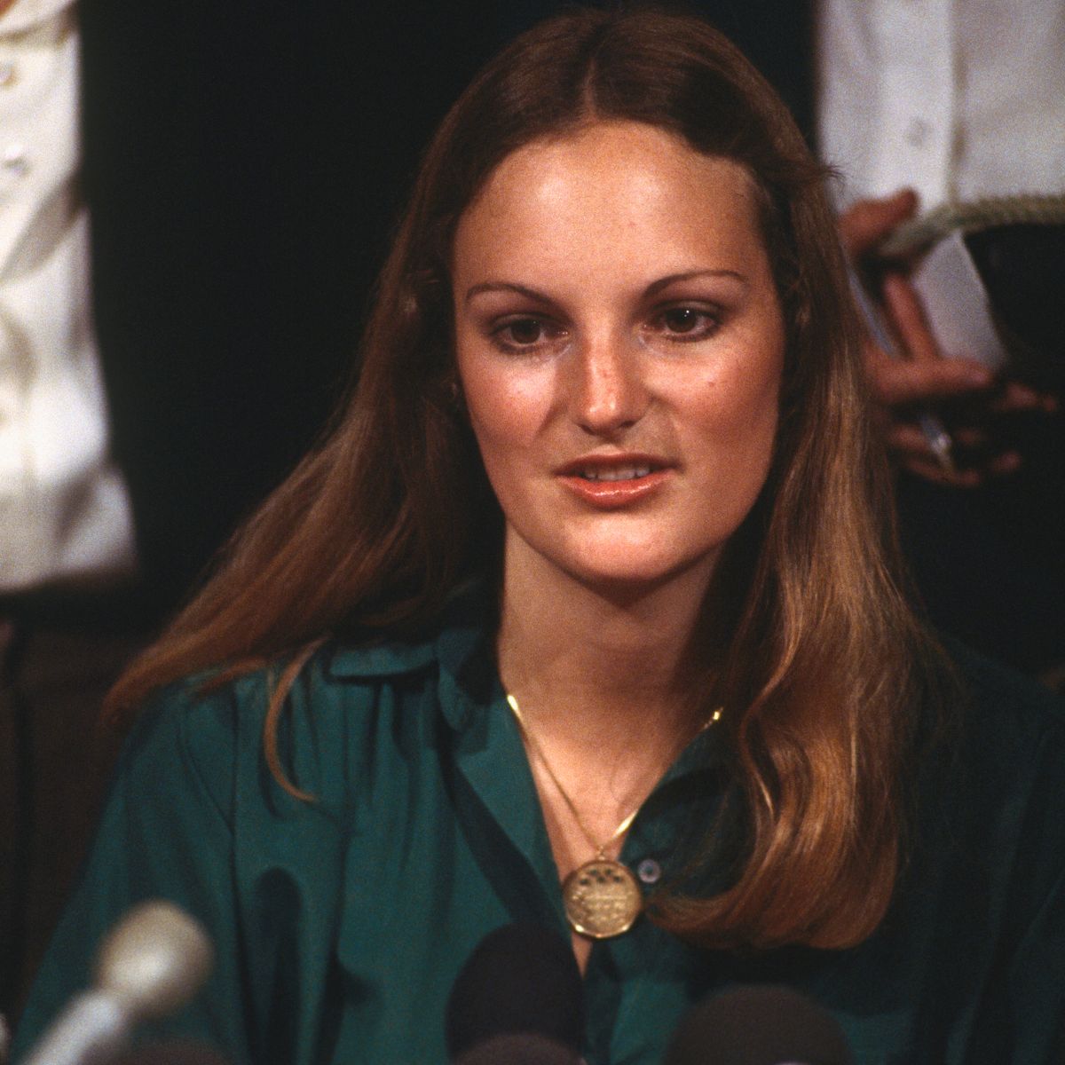Patty Hearst wearing a green polo