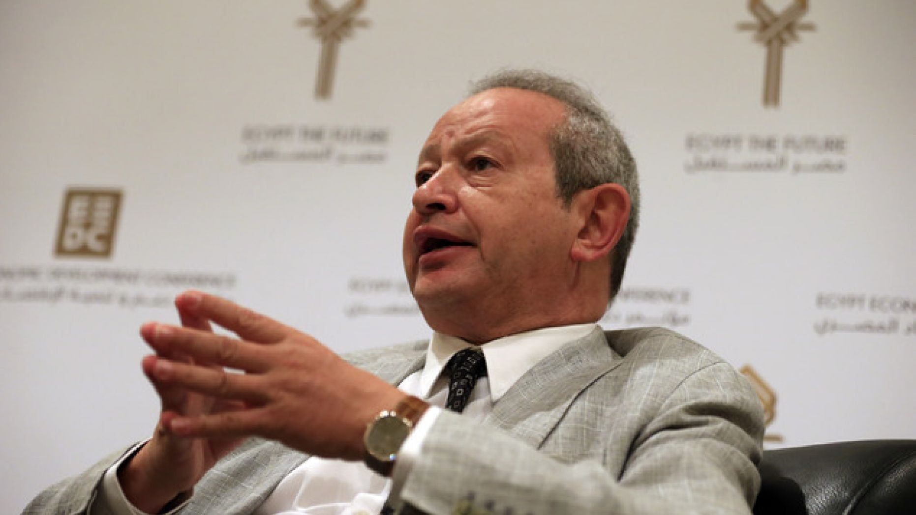 Naguib Sawiris wearing a gray suit