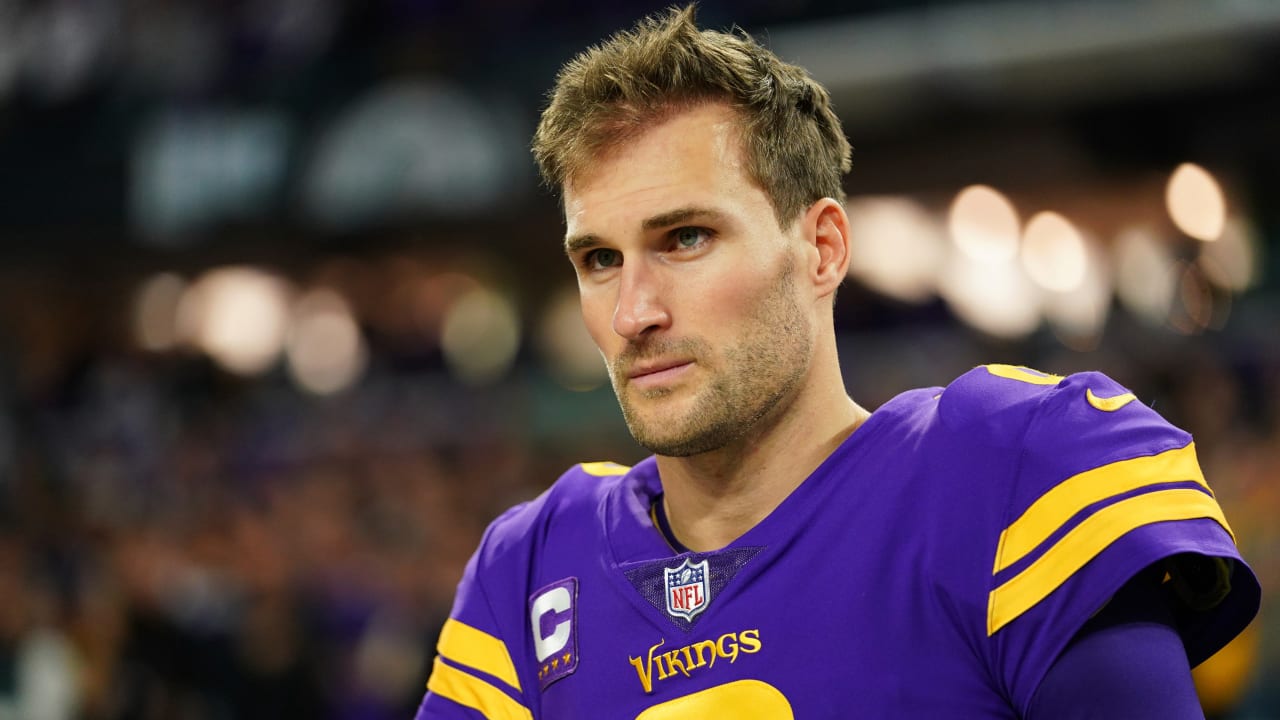 Kirk Cousins wearing a purple and yellow football jersey