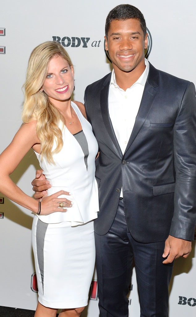Ashton Meem wearing white outfit and Russell Wilson wearing black suit