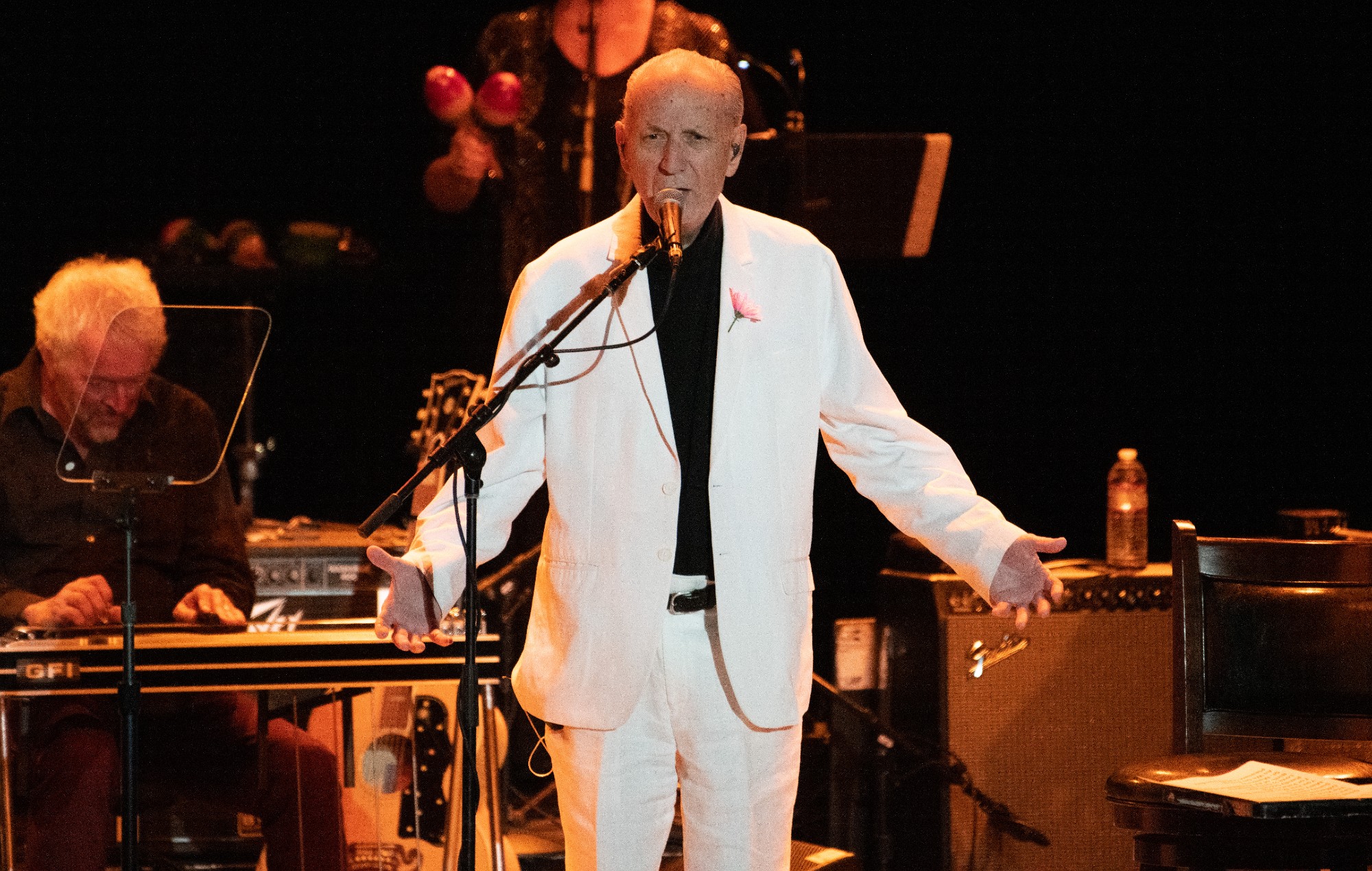 Michael Nesmith wearing a white suit