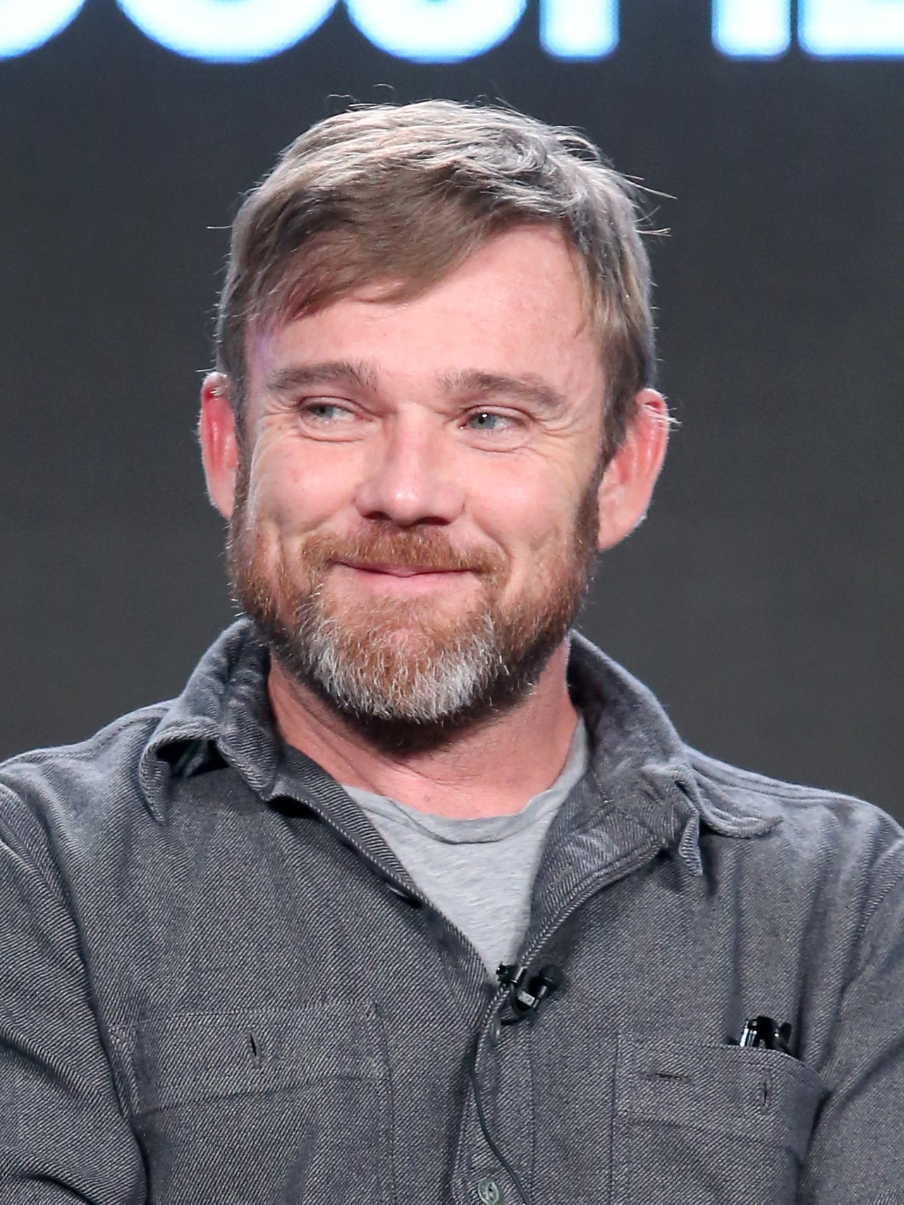 Ricky Schroder wearing a gray polo