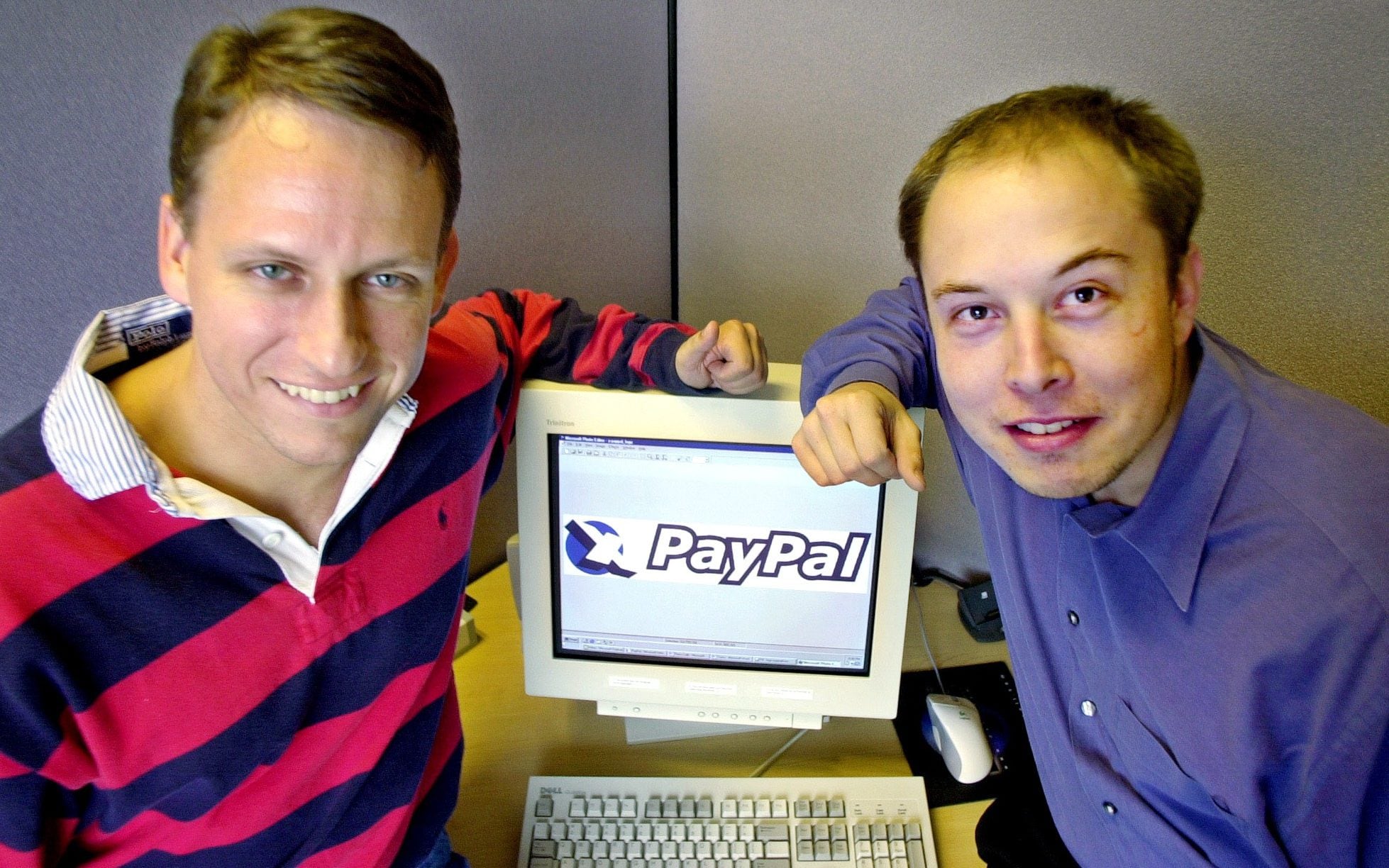 David Sacks and Elon Musk Holding A Computer With Paypal Flashed On Screen