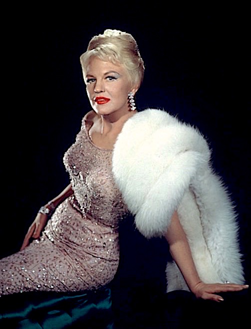 Peggy Lee wearing a pink dress