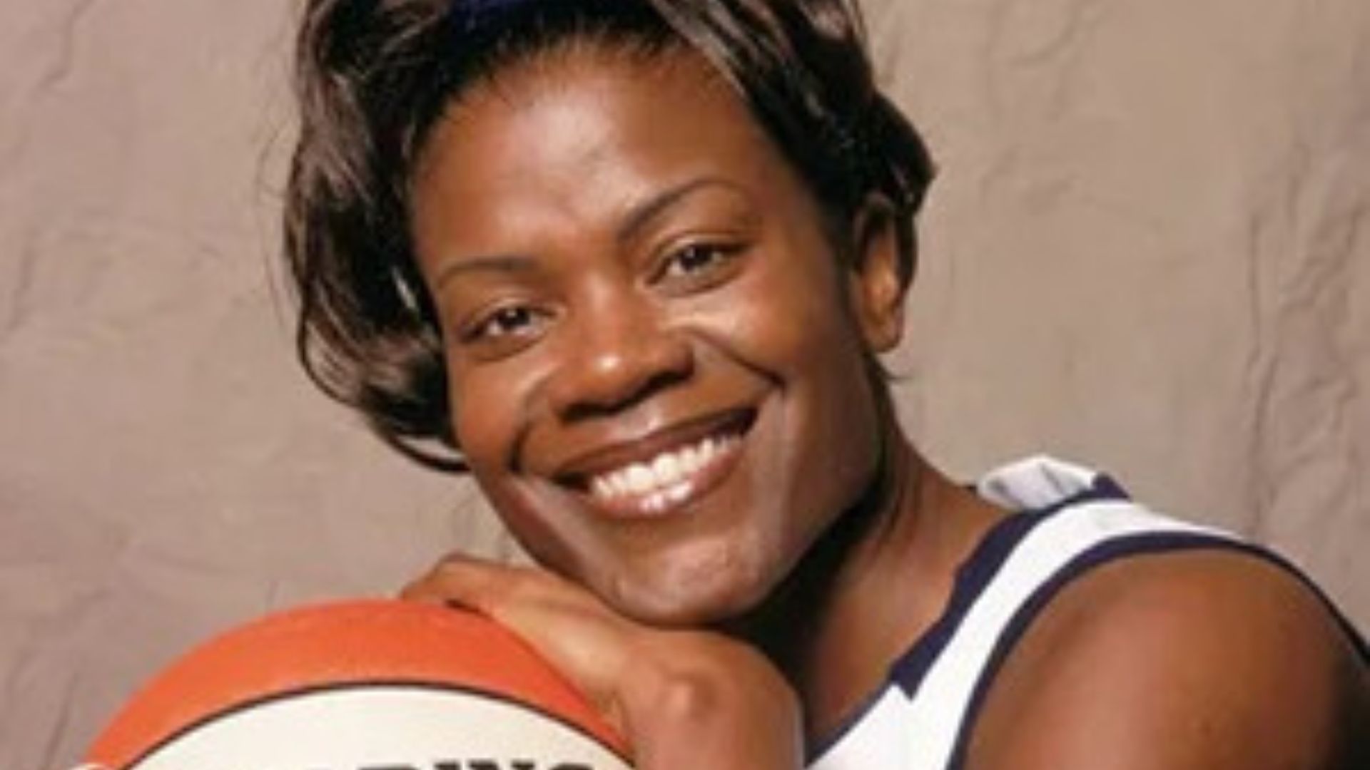 Chris Unclesho's Wife Sheryl Denise Swoopes With Basketball
