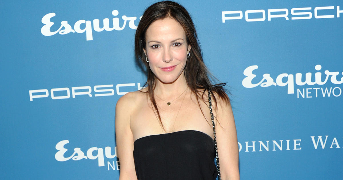 Mary Louise Parker wearing tube black dress