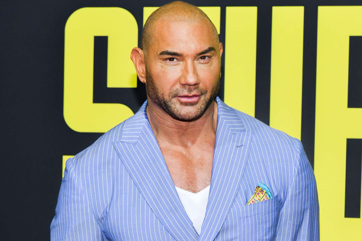 Batista wearing a stripe blue suit
