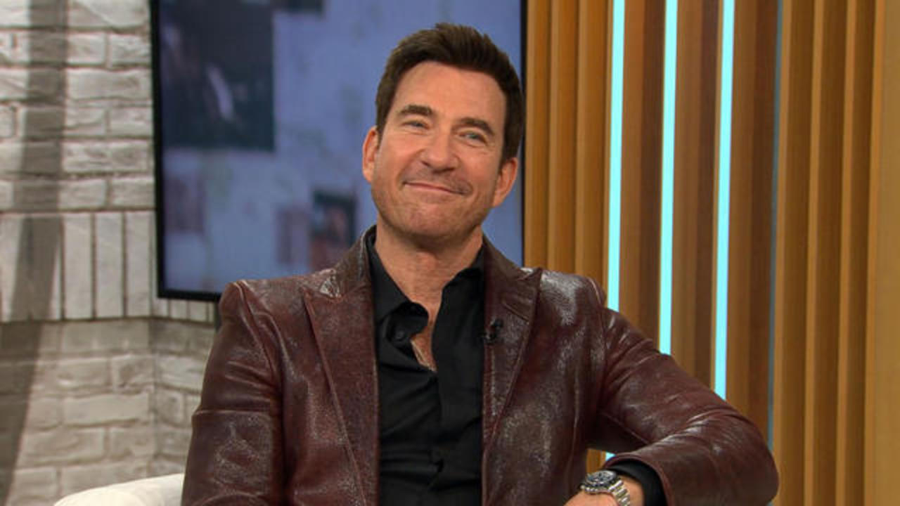 Dylan McDermott wearing a brown leather jacket