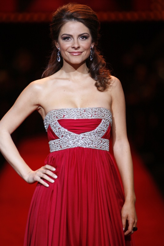 Maria Menounos wearing a red long dress