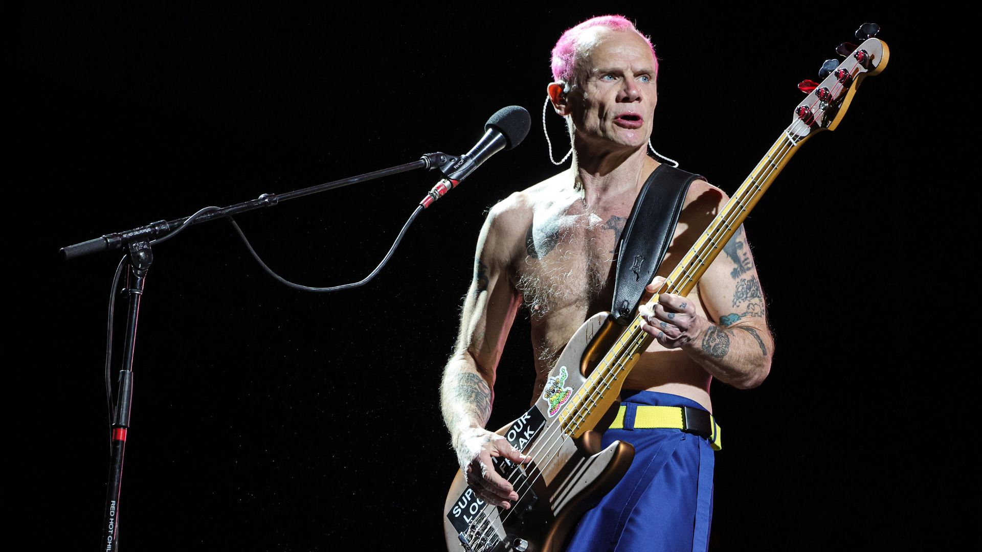 Flea on the stage with his guitar