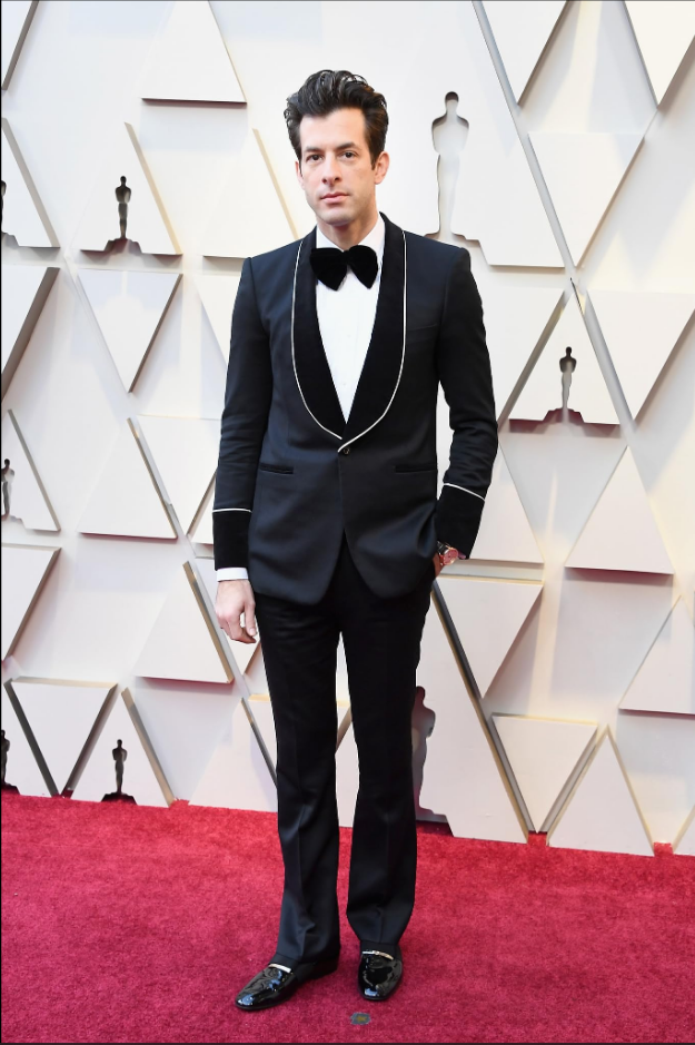 Mark Ronson In Black Suit Standing On Red Carpet