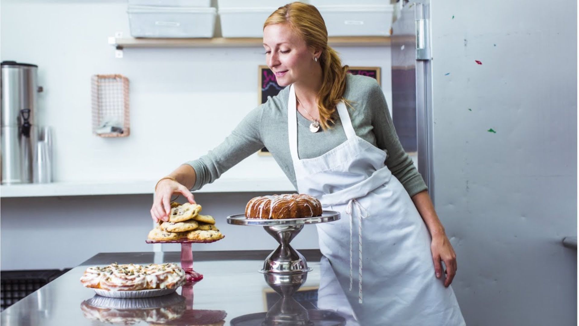 Christina Tosi Standing With Sweet Dishes