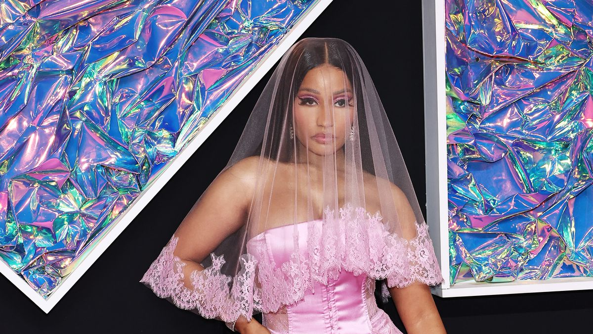 Nicki Minaj wearing a pink dress and veil