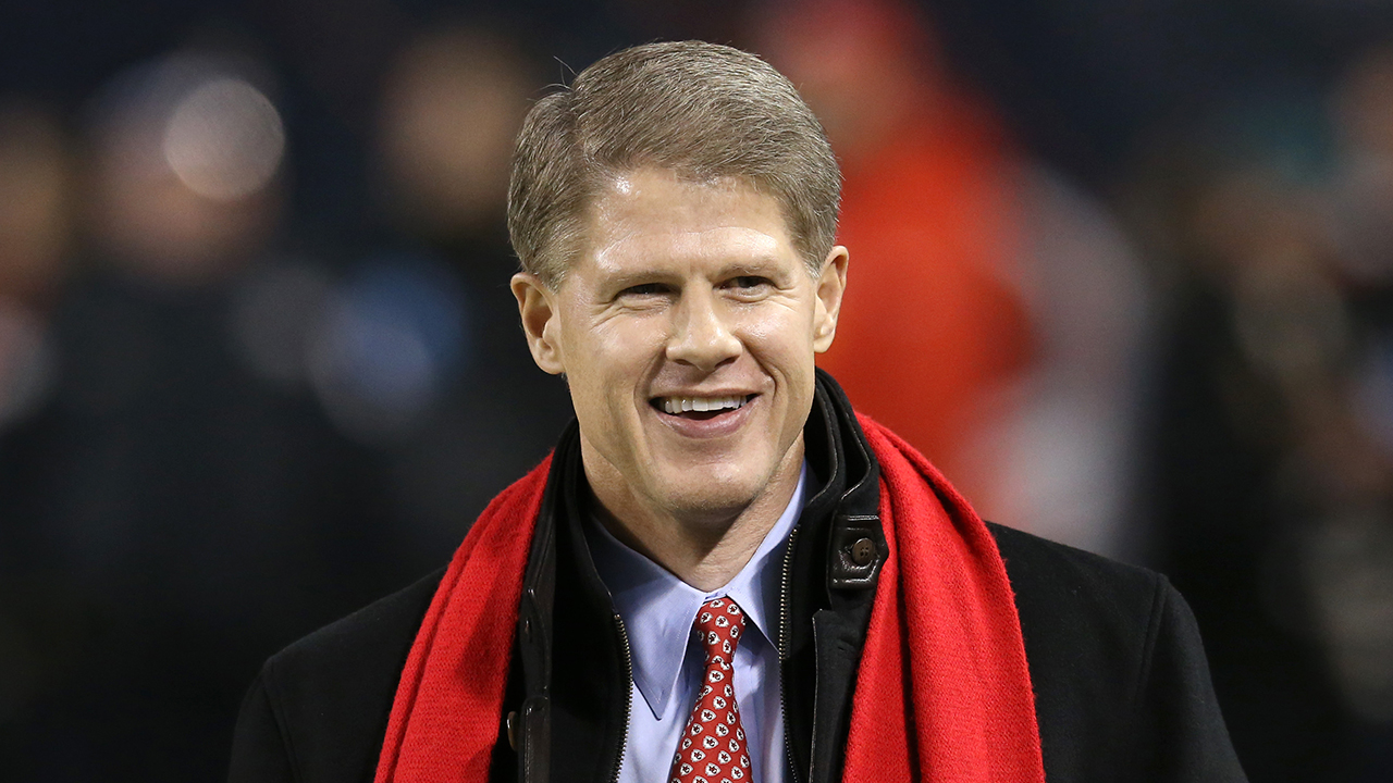 Clark Hunt wearing a coat with red scarf