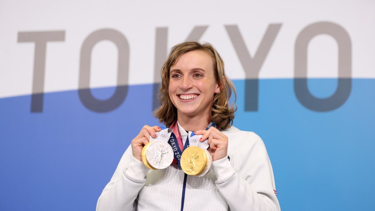 Katie Ledecky holding some medals