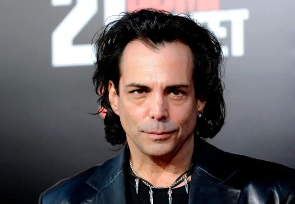 Richard Grieco wearing a leather jacket