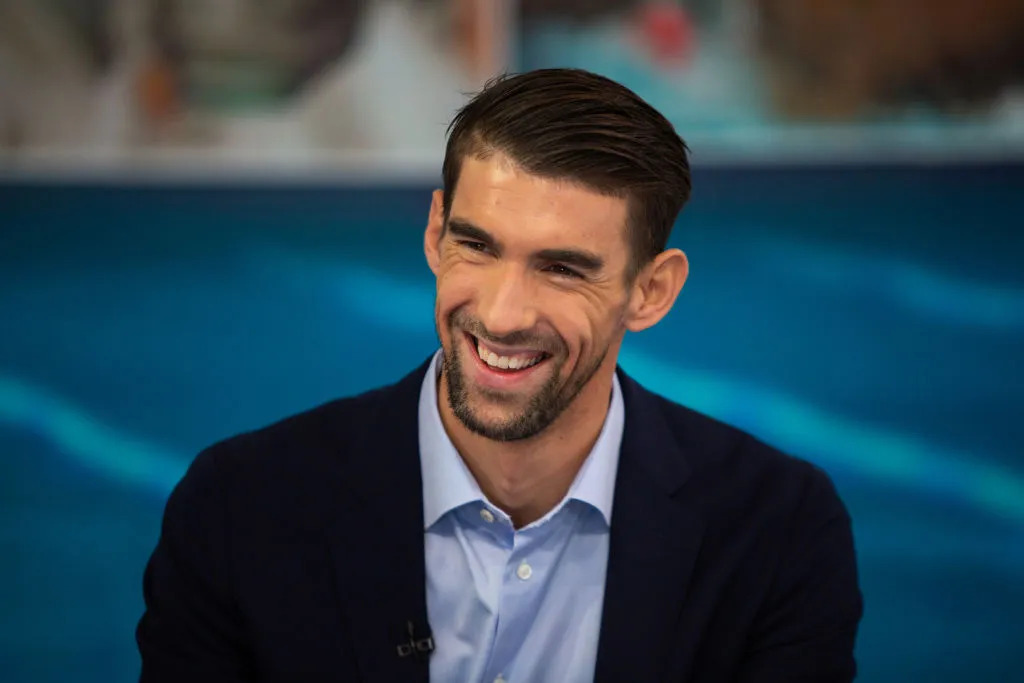 Michael Phelps wearing a black suit