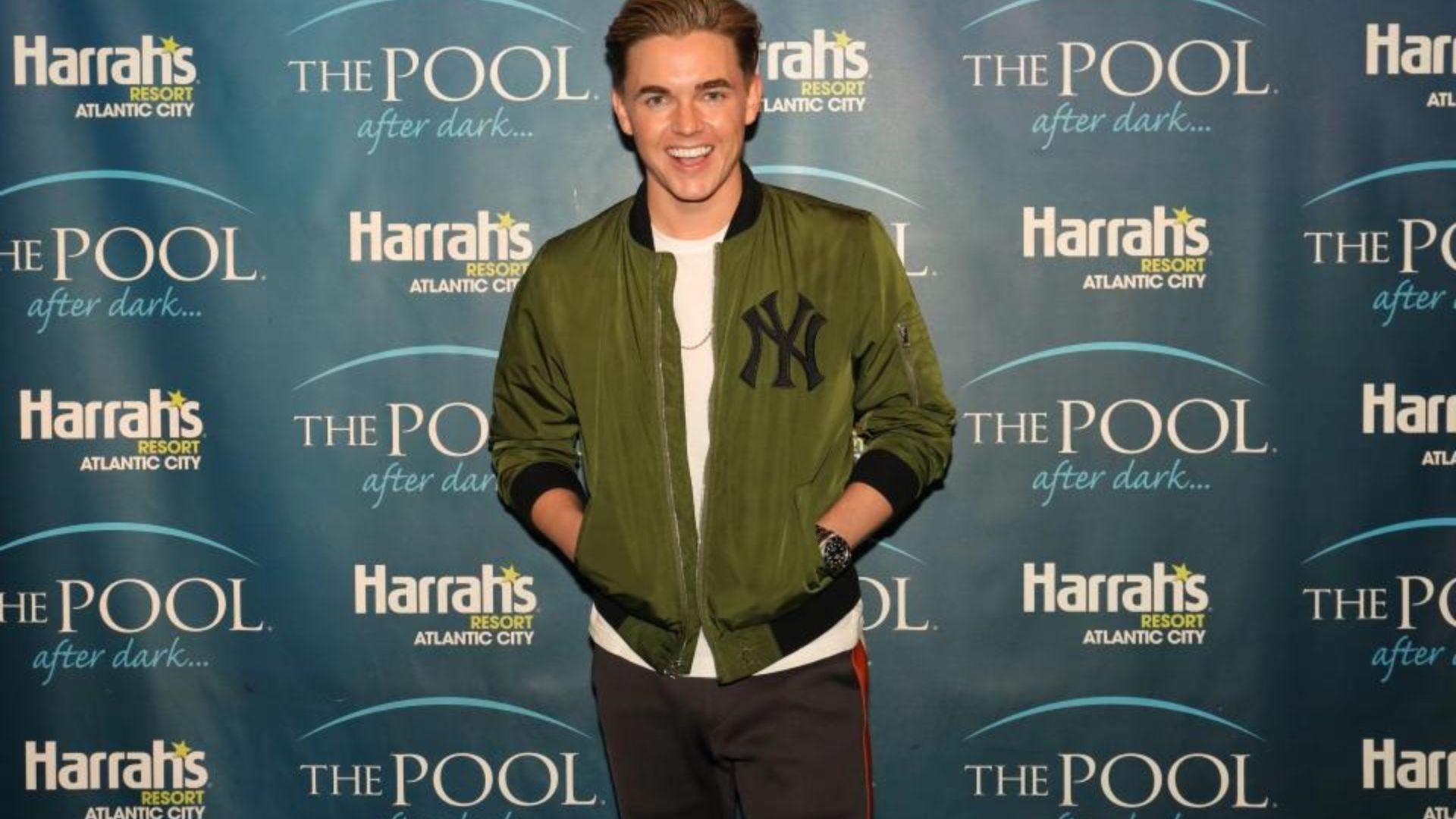 Jesse Mccartney Standing While Hands In Jacket's Pocket