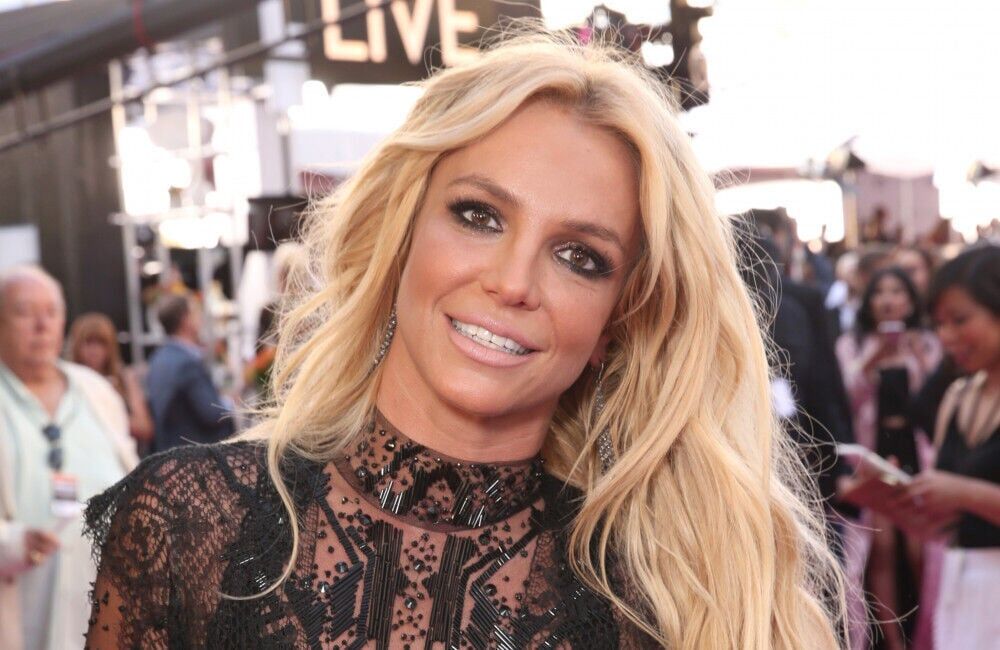 Britney Spears wearing a black see through dress