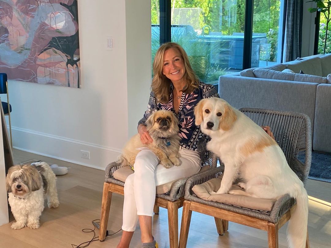 Lara Spencer in her house with her pet dog friends